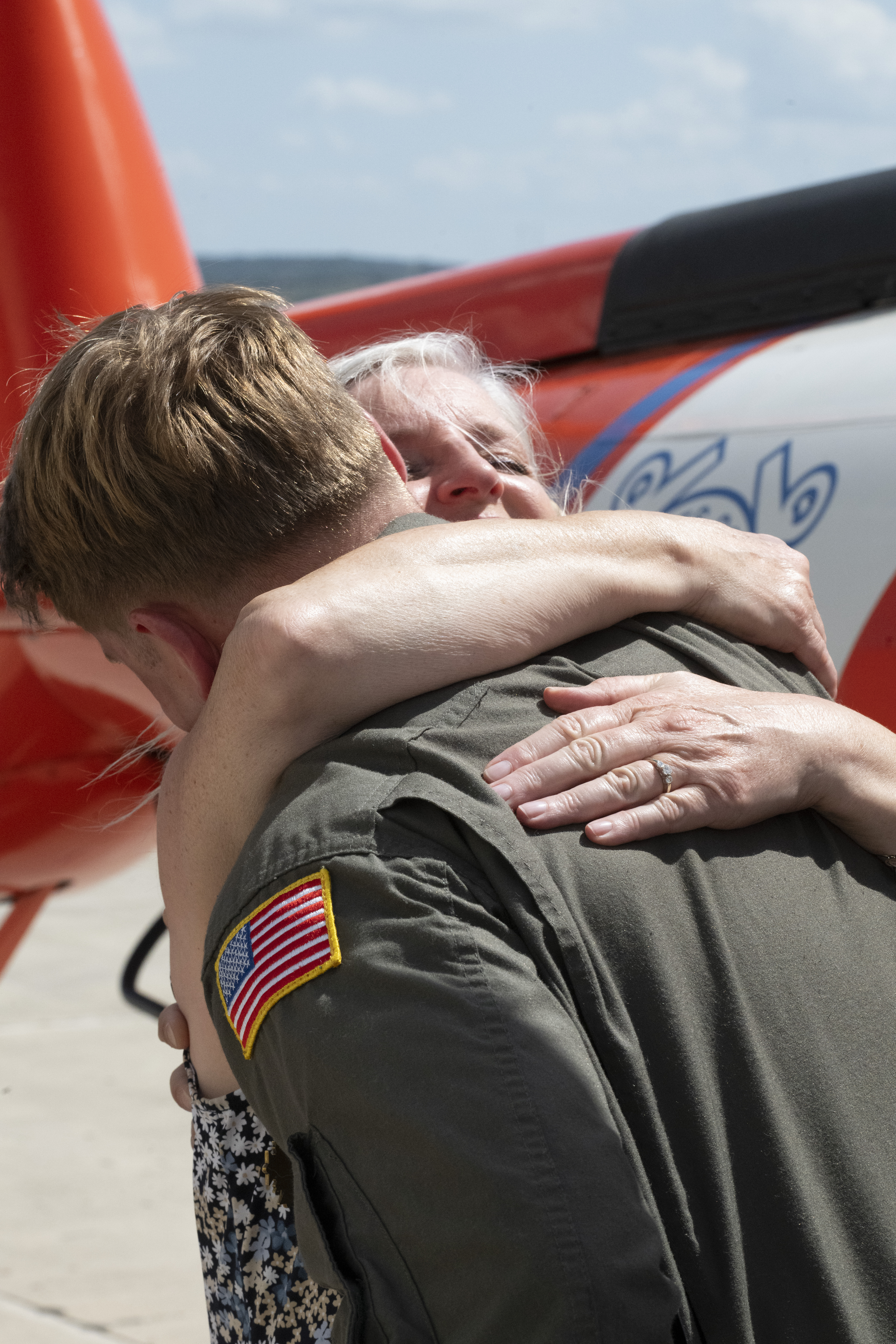 Secretary Kristi Noem presents medals to Lieutenant Ian Hopper, Lieutenant Blair Oguiofor, Petty Officer 3rd Class Scott Ruskan, and Petty Officer 3rd Class Seth Reece of Air Station Corpus Christi during a ceremony on July 11, 2025. The medals recognize their roles in the Camp Mystic rescue on July 4, when Coast Guard crews evacuated dozens of campers and staff amid flash flooding at the Guadalupe River. (U.S. Coast Guard photo by Petty Officer 3rd Class Perry Shirzad/Released) Secretary Kristi Noem presents medals to Lieutenant Ian Hopper, Lieutenant Blair Oguiofor, Petty Officer 3rd Class Scott Ruskan, and Petty Officer 3rd Class Seth Reece of Air Station Corpus Christi during a ceremony on July 11, 2025. The medals recognize their roles in the Camp Mystic rescue on July 4, when Coast Guard crews evacuated dozens of campers and staff amid flash flooding at the Guadalupe River. (U.S. Coast Guard photo by Petty Officer 3rd Class Perry Shirzad/Released)